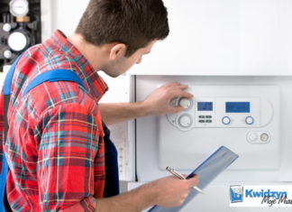 Pieniądze na zmianę sposobu ogrzewania Mężczyzna serwisujący ogrzewanie