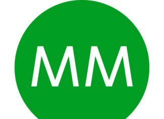 Test zakładowego systemu ostrzegania i alarmowania logo MM Kwidzyn, duże, białe litery MM na zielonym tle